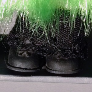 Schwarze Schuhe der Hulapuppe